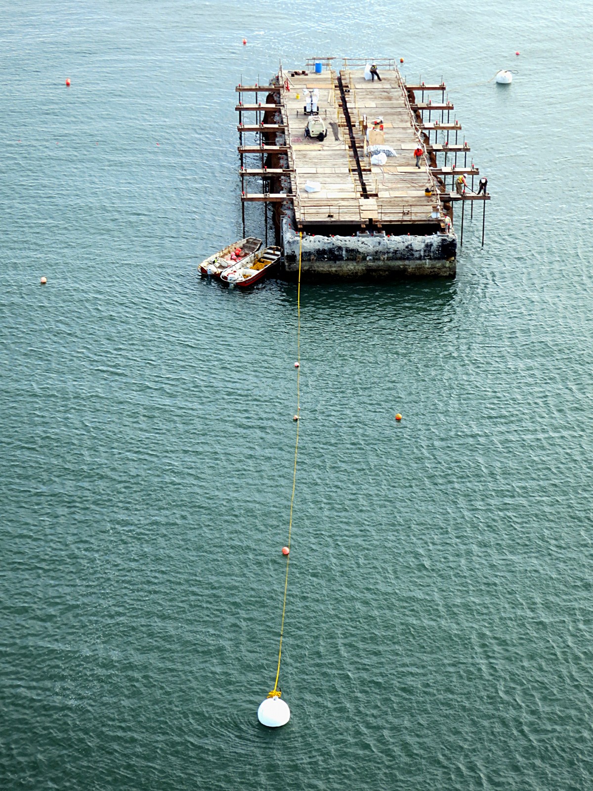 Bay Bridge Assay 1: workmen set charges on the old pier.