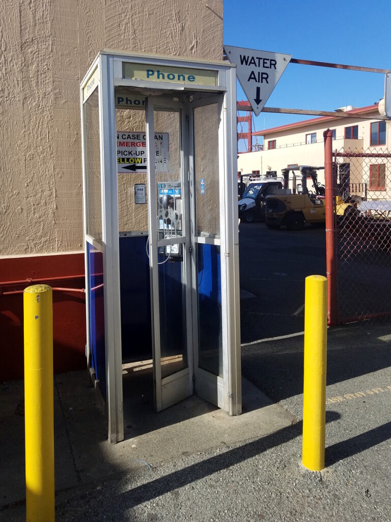 Photo of a telephone booth and air/water station near the GGB